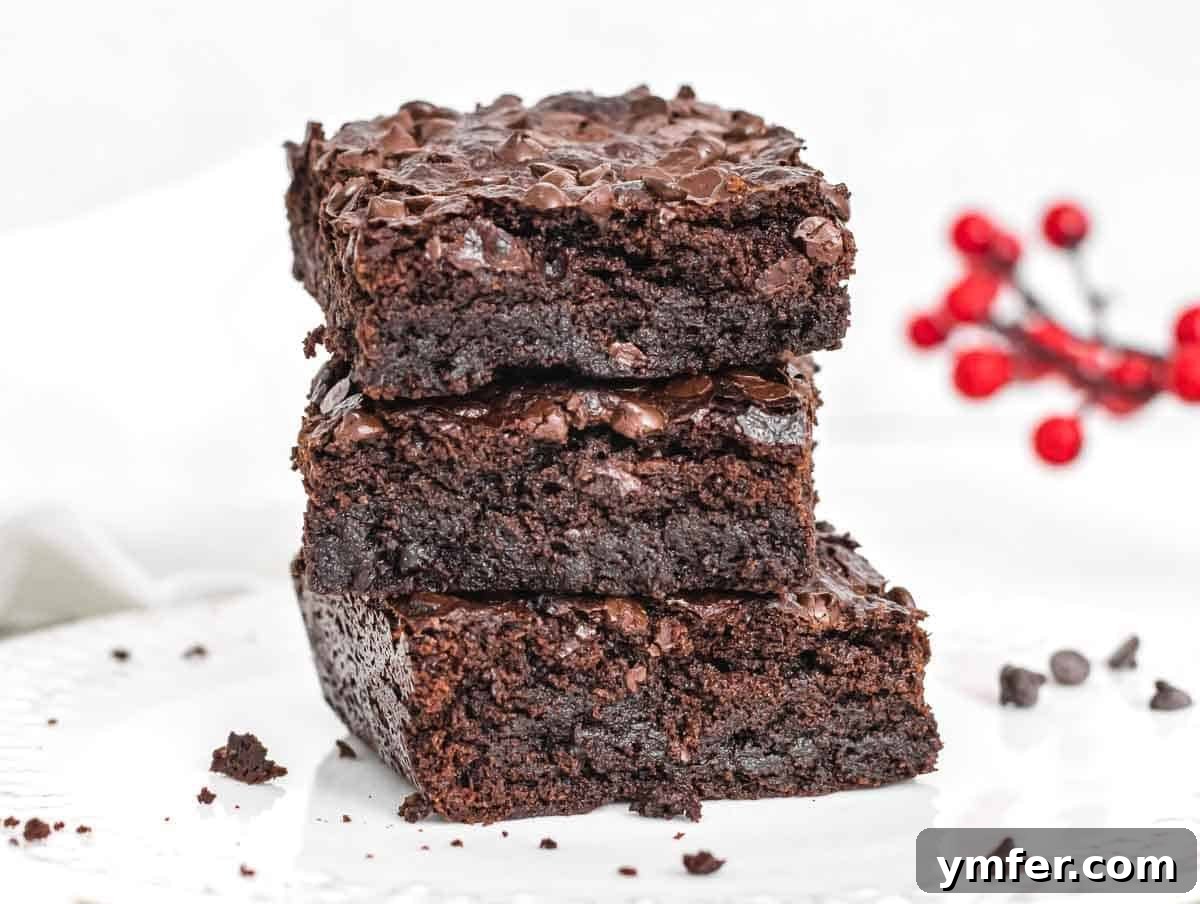 Decadent Plant-Based Brownies 5 Vegan brownies stacked on a plate