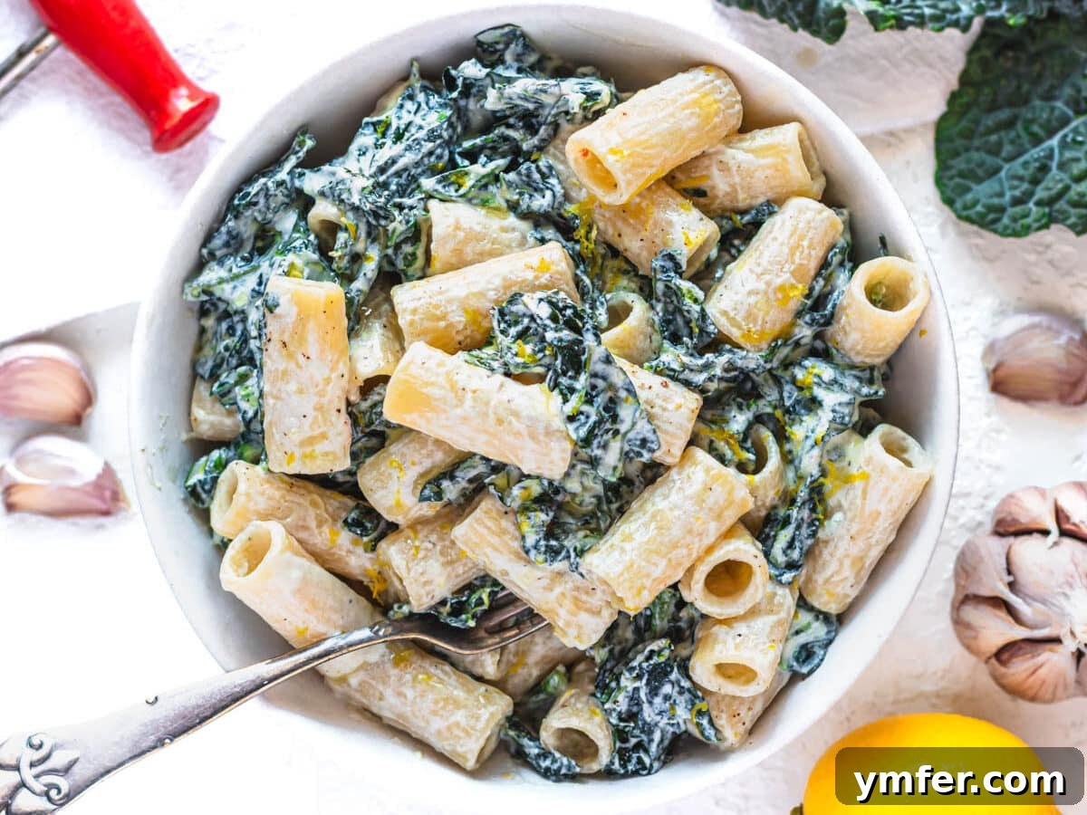 Royal Spire Sweet 5 Close-up of creamy kale pasta in a bowl with a silver fork