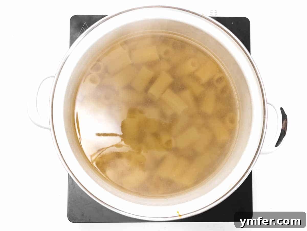 Royal Spire Sweet 6 Rigatoni pasta cooking in a large pot of salted boiling water