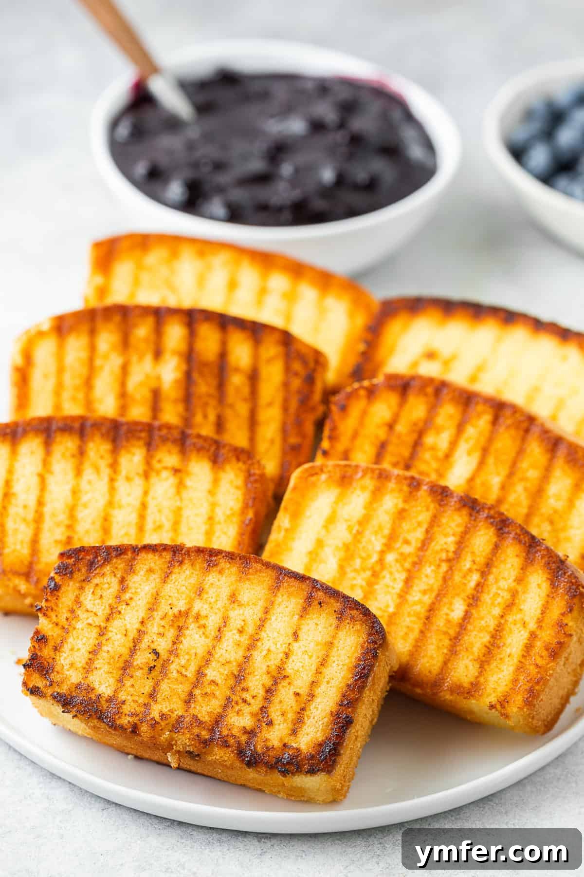 Flame-Kissed Pound Slice 3 A plate of grilled pound cake.