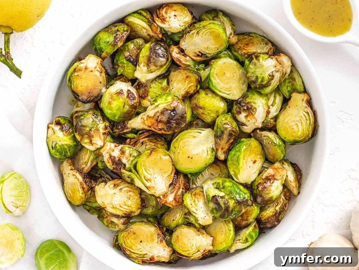 Crispy Air Fryer Brussels Sprouts 10 Air fryer Brussels Sprouts in a white bowl