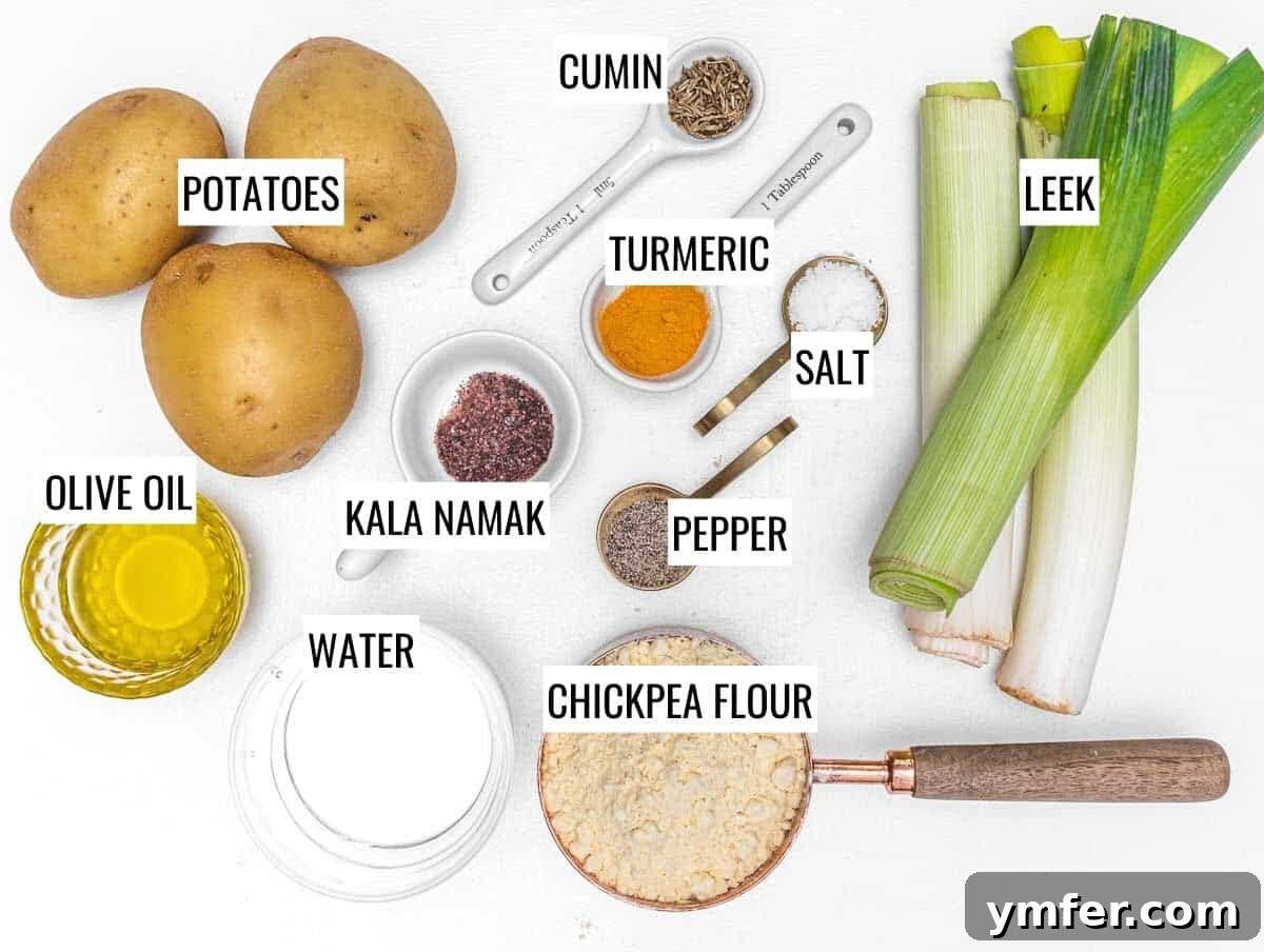 Vegan Potato Frittata 4 A vibrant display of fresh ingredients for vegan potato frittata: potatoes, leeks, chickpea flour, olive oil, and spices.