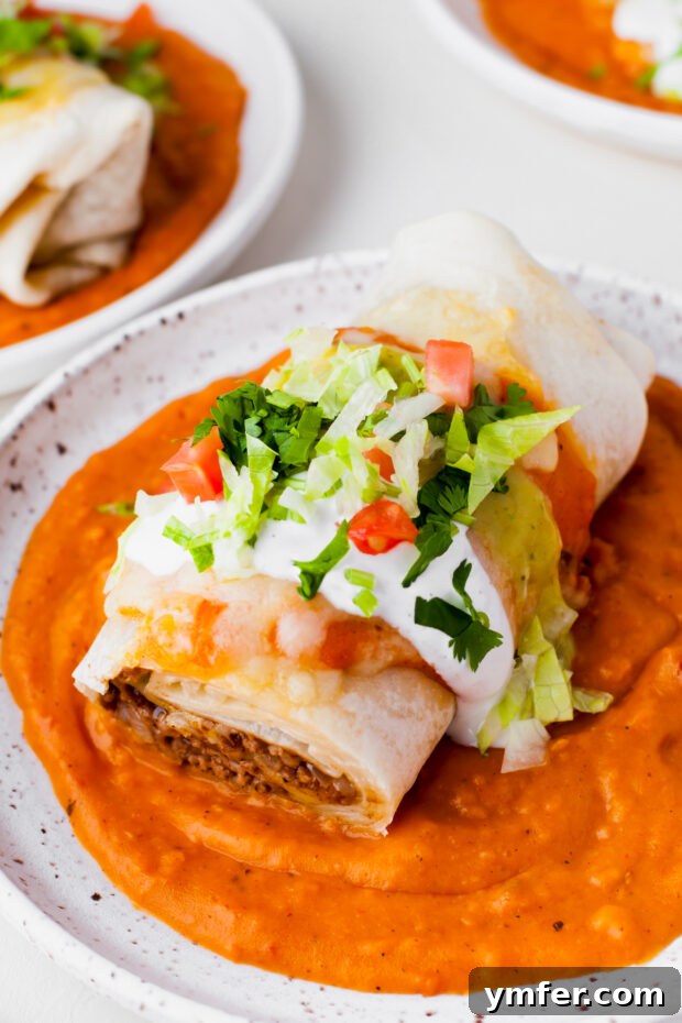 Richly Sauced Burritos 2 Smothered Burritos topped with sour cream, cheese, and lettuce.