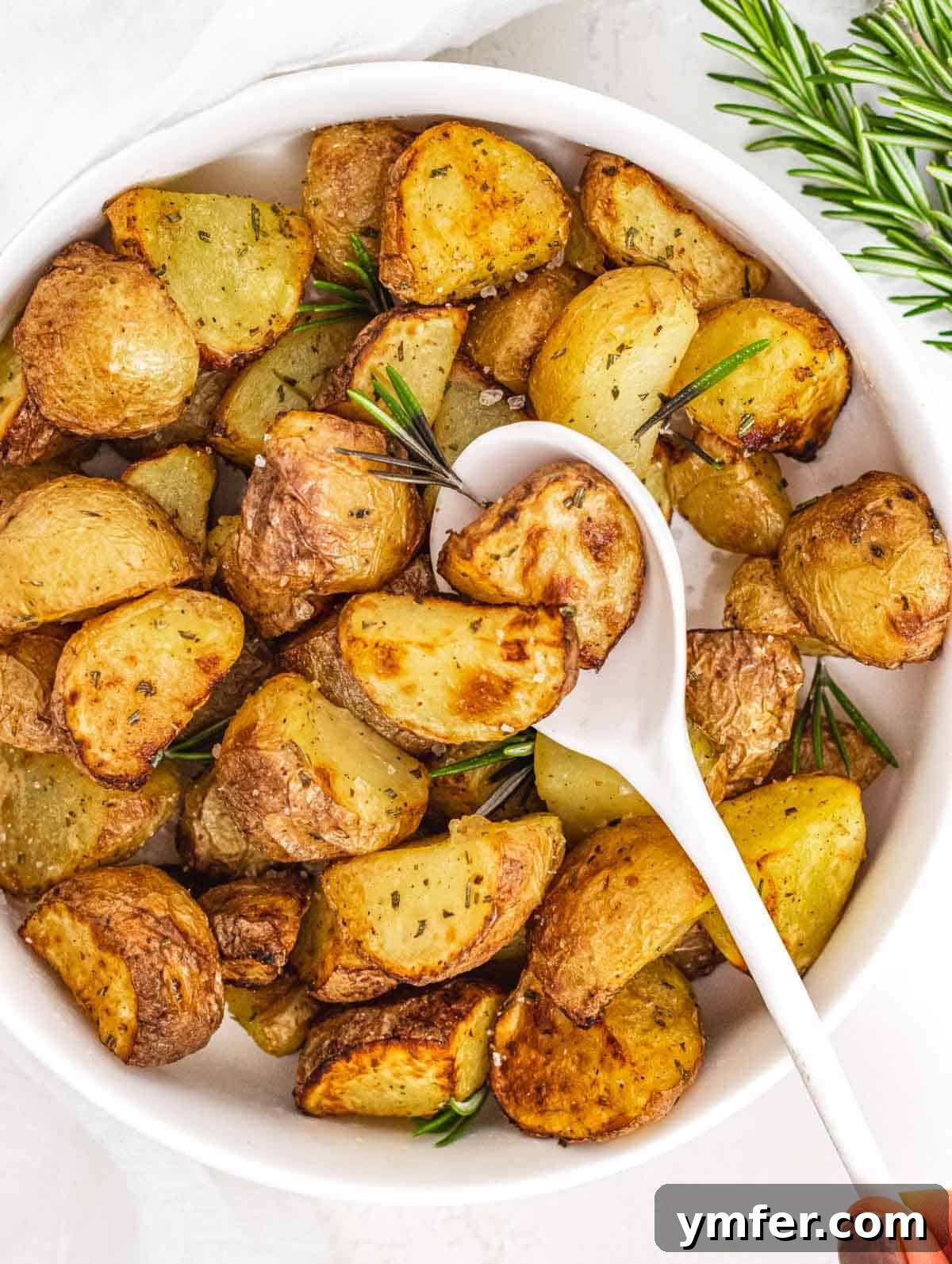 Crispy Air Fryer Potatoes 2 Air fryer potatoes with white spoon