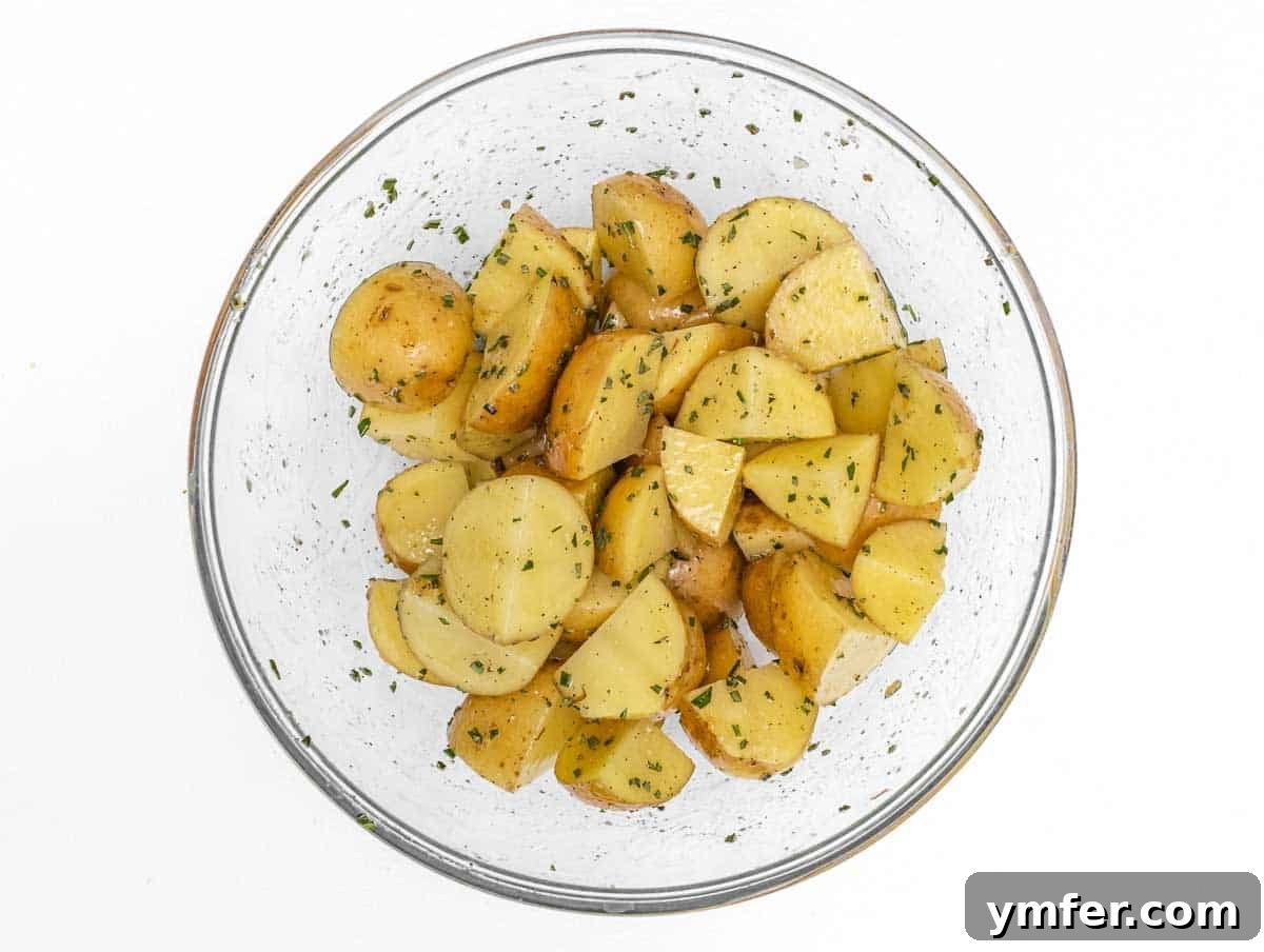 Crispy Air Fryer Potatoes 7 potatoes covered in herbs