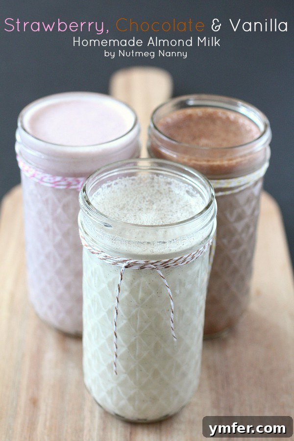 Homemade Almond Milk by Nutmeg Nanny Homemade almond milk in a glass bottle, with separate glasses of vanilla, chocolate, and strawberry almond milk variations, showcasing fresh, delicious, and easy-to-make plant-based milk.