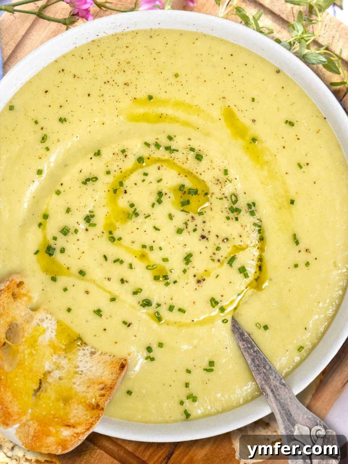 Naturally Creamy Potato Leek Soup with Skyr 2 Healthy potato leek soup with skyr photographed from above with bread on the side.