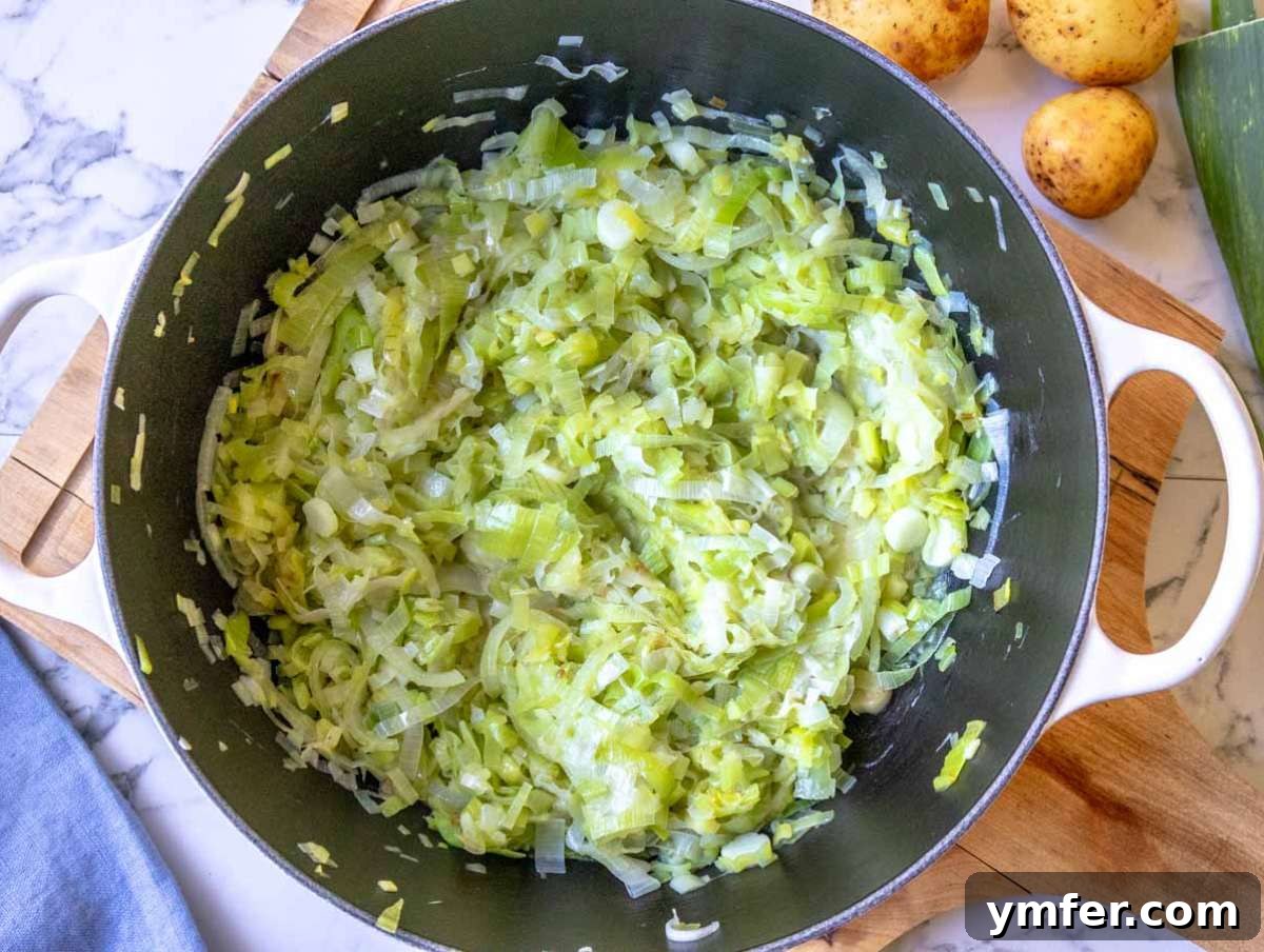 Naturally Creamy Potato Leek Soup with Skyr 4 Step 1 Sliced leeks and onion cooking in olive oil for potato soup base.