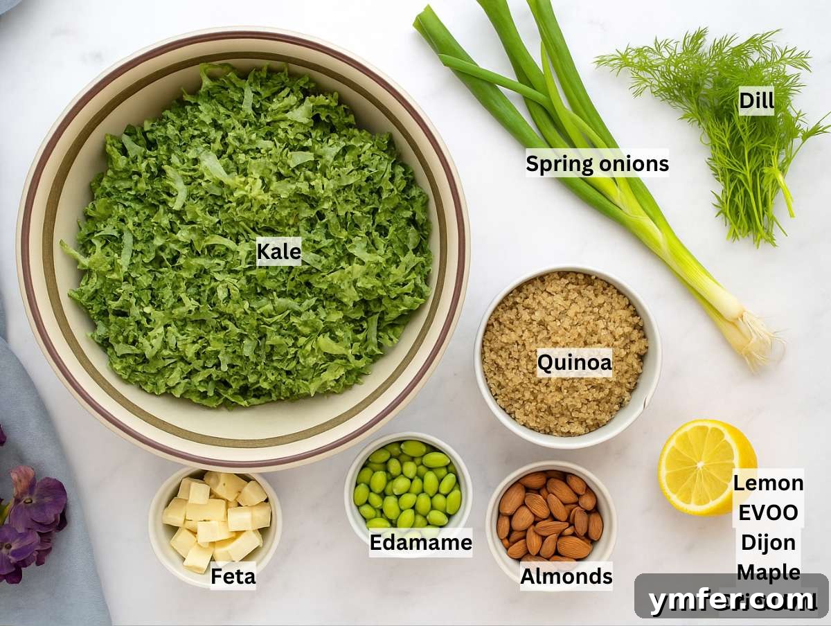 All ingredients for the kale quinoa salad tossed in the bowl with the dressingngredients for kale quinoa salad arranged on a marble surface, including chopped kale, cooked quinoa, edamame, feta, a