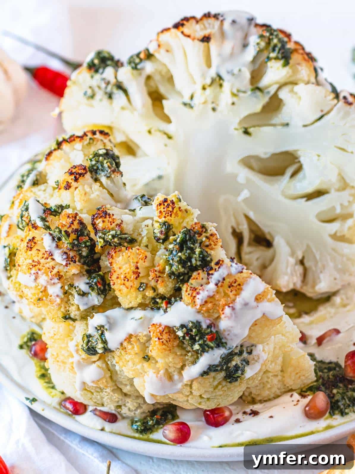Glorious Whole Roasted Cauliflower 2 whole roasted cauliflower cut in half with chermoula sauce