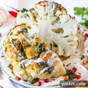 Glorious Whole Roasted Cauliflower 13 whole roasted cauliflower cut in half with a green chermoula sauce