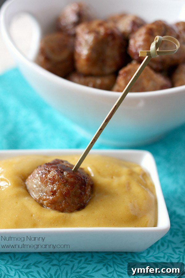 Pork Meatballs with Mango Honey Mustard Dipping Sauce by Nutmeg Nanny Close-up of baked Pork Meatballs with Mango Honey Mustard Dipping Sauce