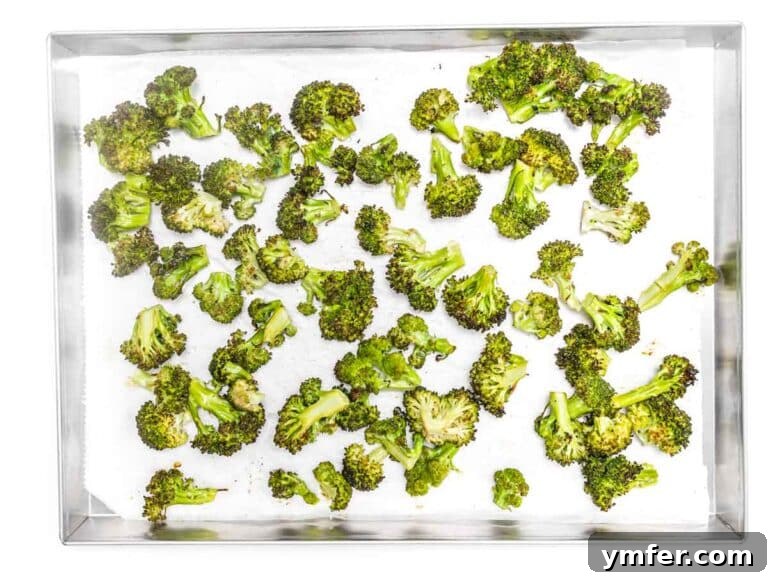 Quick & Delicious: 20 Easy Broccoli Recipes 23 Baked broccoli florets in a silver tray, golden and tender-crisp.