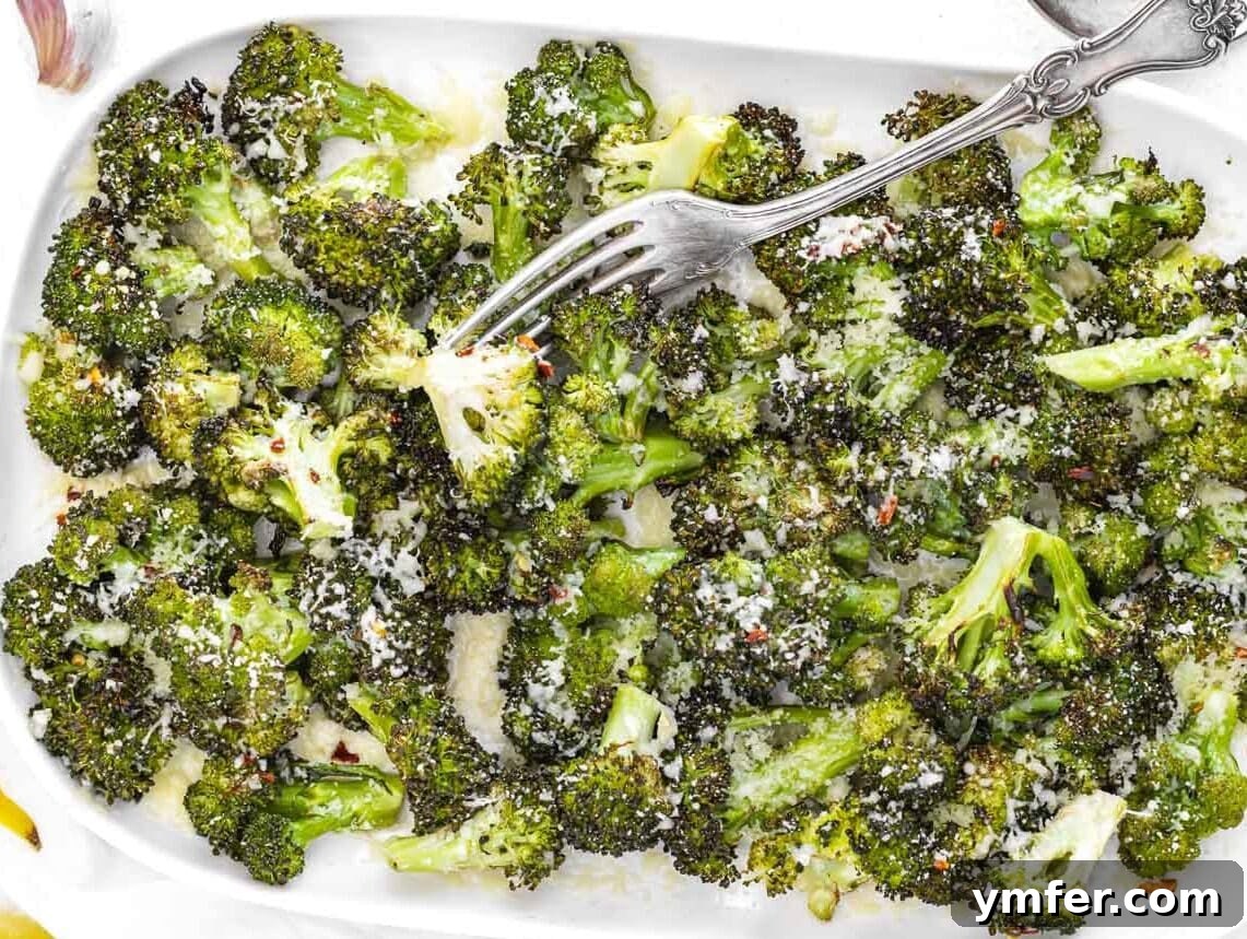 Quick & Delicious: 20 Easy Broccoli Recipes 4 Crispy roasted broccoli florets topped with grated Parmesan cheese, a perfect savory side dish.