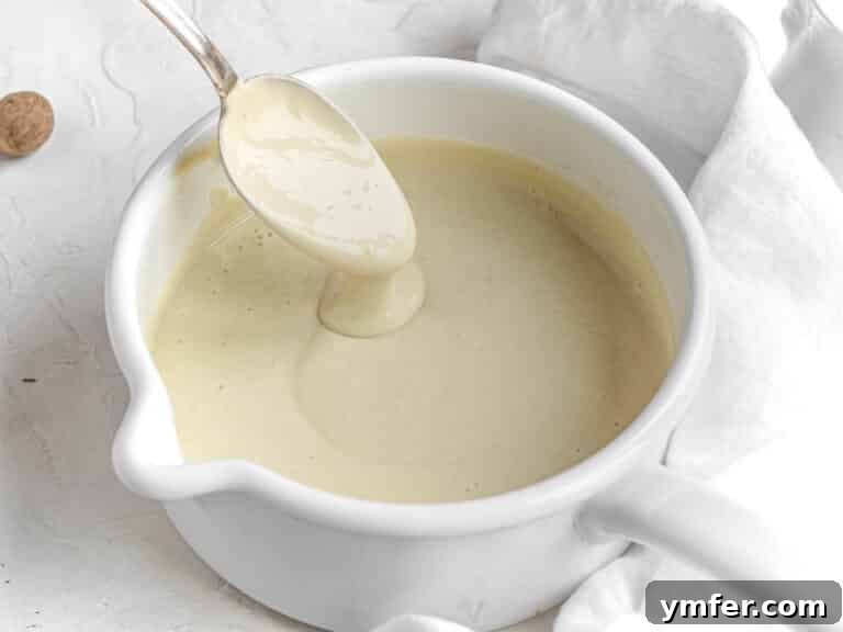 Luscious Vegan Cream Sauce 12 Finished creamy vegan béchamel sauce showcased in a clean saucepan.