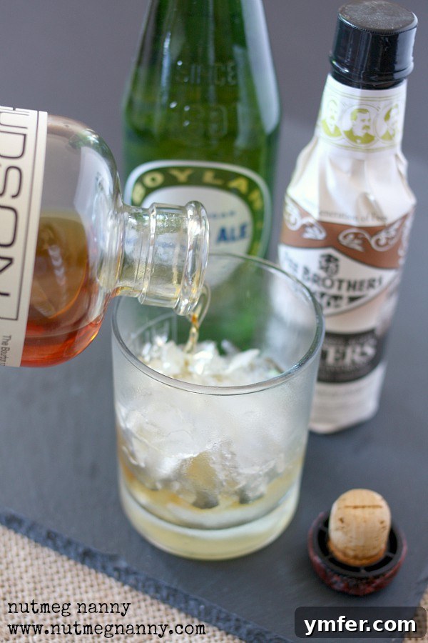 Bourbon and Ginger Ale by Nutmeg Nanny Bourbon getting poured into a glass.