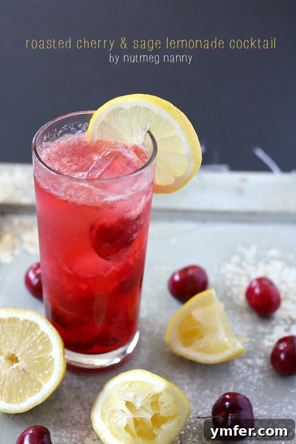 Roasted Cherry Sage Lemonade Cocktail by Nutmeg Nanny Roasted Cherry Sage Lemonade Cocktail served in a elegant glass, showcasing its vibrant color and tempting garnish.