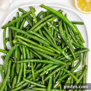 Sautéed Green Beans with Lemon and Garlic on a white plate