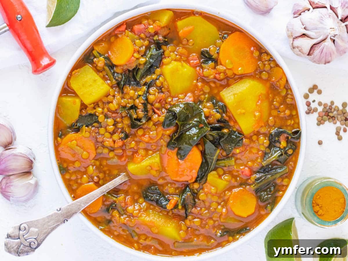 Kale, Simplified 5 Warming curry lentil soup with garlic, turmeric, and lime wedges