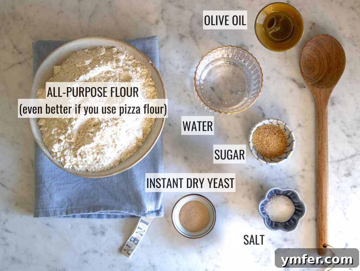 Pillowy Naan 5 All the necessary ingredients for homemade naan bread laid out on a kitchen counter: flour, water, yeast, sugar, salt, and olive oil.
