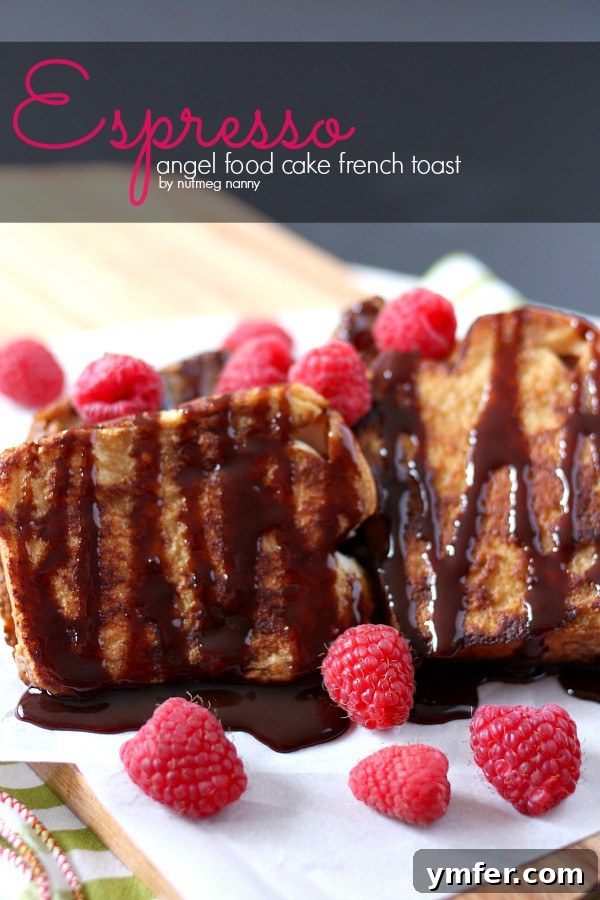 Golden brown Espresso Angel Food Cake French Toast slices stacked on a plate, drizzled with chocolate sauce and fresh raspberries.