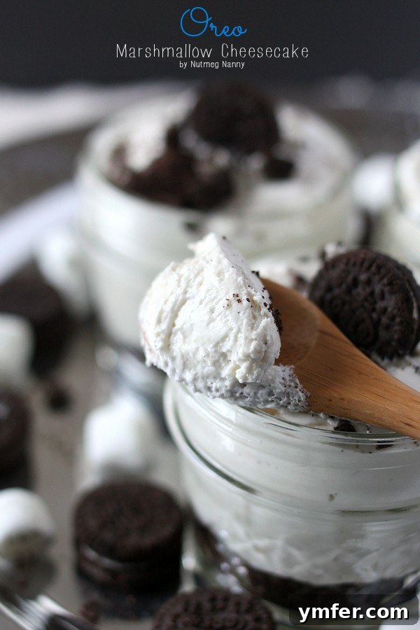 Full No-Bake Oreo Marshmallow Cheesecake in a dish by Nutmeg Nanny