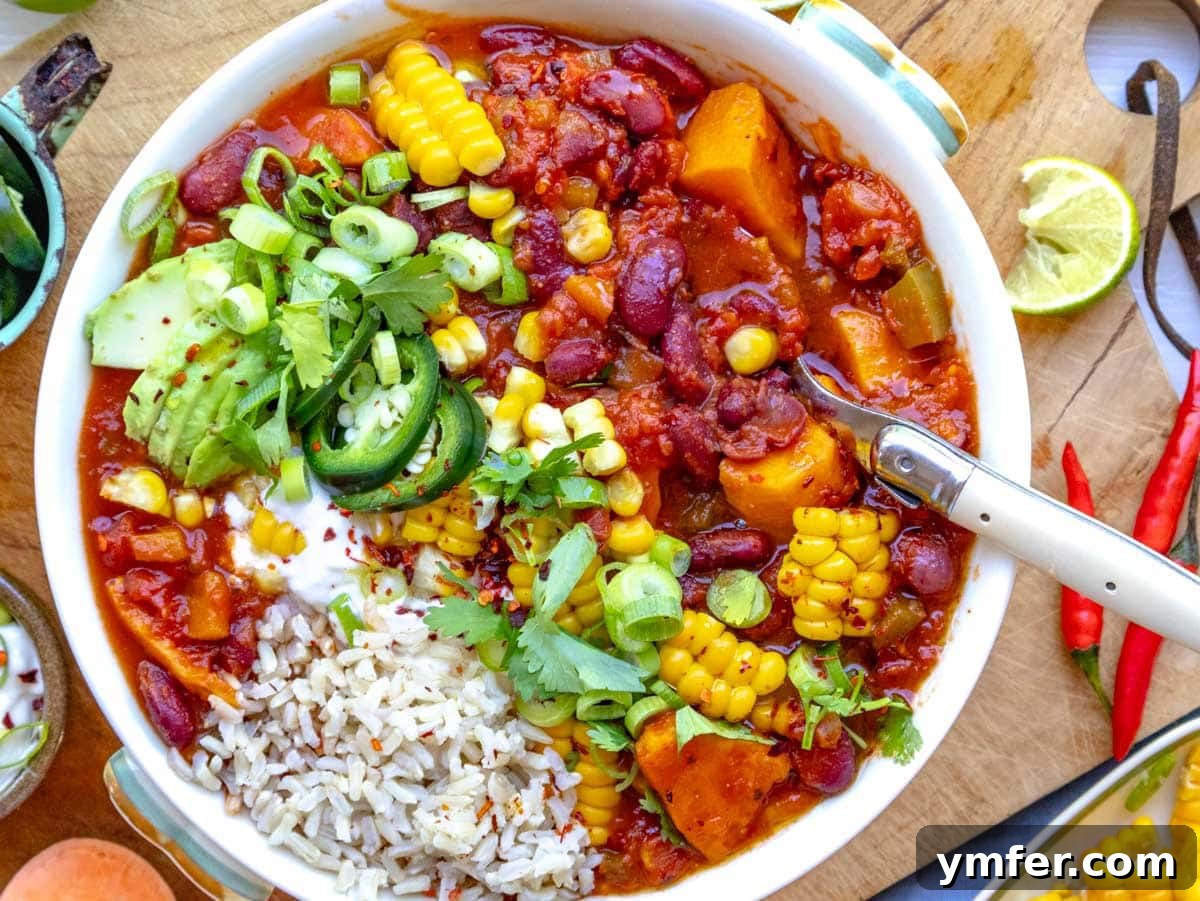 Hearty Sweet Potato Chili 5 sweet potato chili served with rice and topped with jalapeños, sour cream, and corn