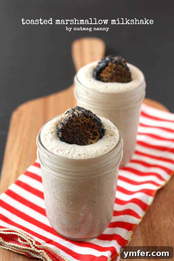 Heavenly Toasted Marshmallow Milkshake by Nutmeg Nanny Indulge in the best Toasted Marshmallow Milkshake recipe for a perfect summer treat. Creamy vanilla ice cream blended with perfectly golden-brown toasted marshmallows.