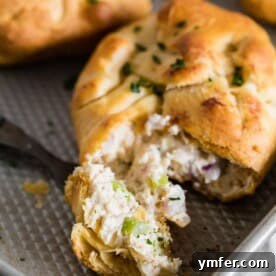 Delicious Chicken Crescent Packets with a creamy chicken, cream cheese, red onion, and celery filling.