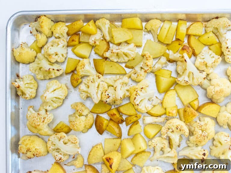 Roasted cauliflower and potatoes in the oven.