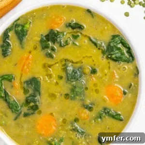Split pea soup with spinach, a rich and creamy vegan meal, ready to be served.