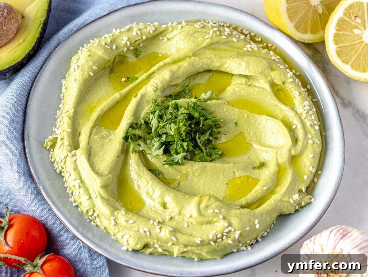 Effortless St Patricks Day Delights 5 A bowl of creamy avocado spread, perfect for dipping at a party.
