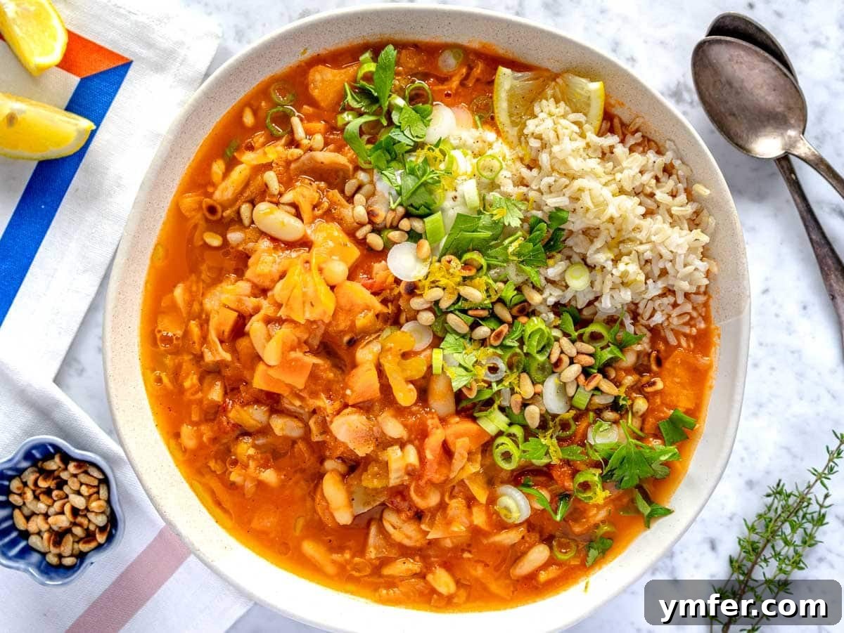 Effortless St Patricks Day Delights 13 Hearty cabbage soup served in a white bowl.