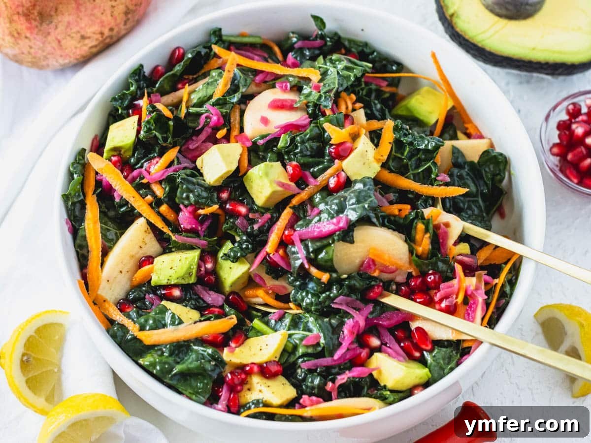 Effortless St Patricks Day Delights 16 A vibrant kale salad in a white bowl with lemons and avocado on the side.