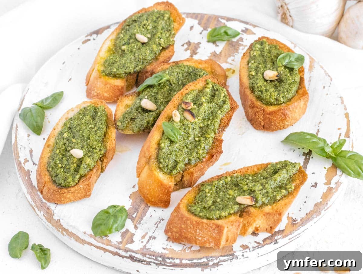 Effortless St Patricks Day Delights 6 Crostini topped with fresh basil pesto and pine nuts, a perfect green appetizer.