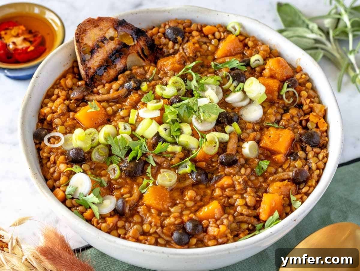 Effortless St Patricks Day Delights 10 A bowl of rich lentil stew served with crusty bread.