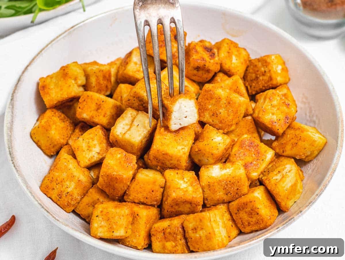 Sizzling Japanese Udon Stir-fry 14 Fried tofu with a silver fork