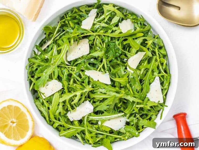 Rucola Rocket Greens with Citrus Vinaigrette 19 Arugula salad with lemon and shaved parmesan ready to serve