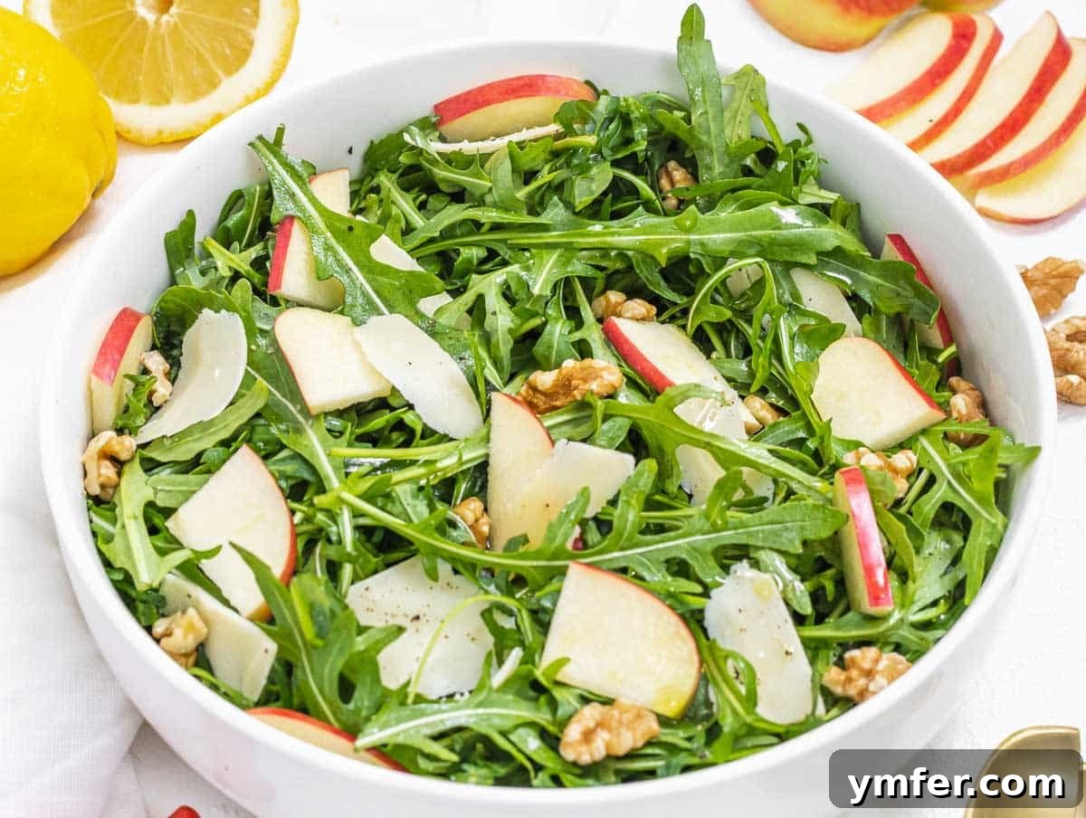 Rucola Rocket Greens with Citrus Vinaigrette 10 Arugula salad with vibrant red apple slices