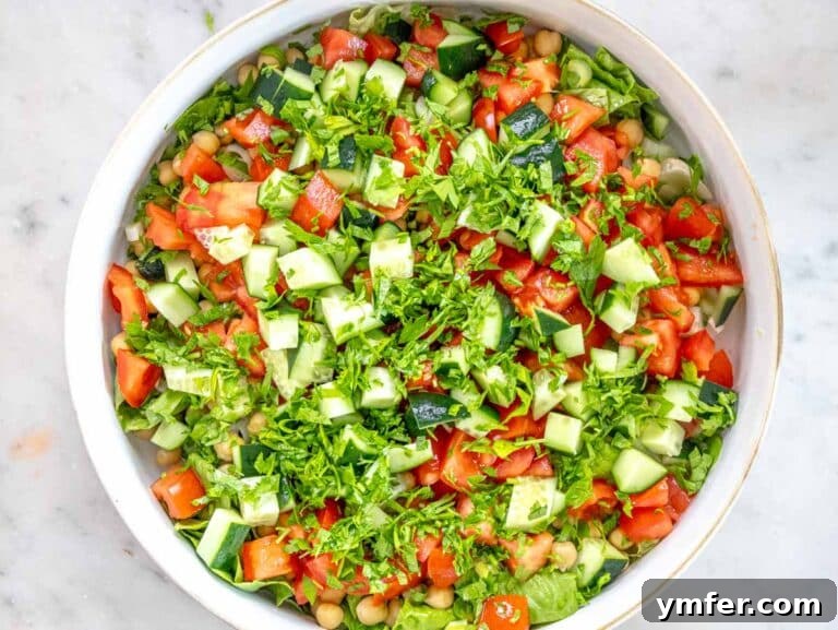 Zesty Tahini Salad 13 vegetables chopped and added to a bowl