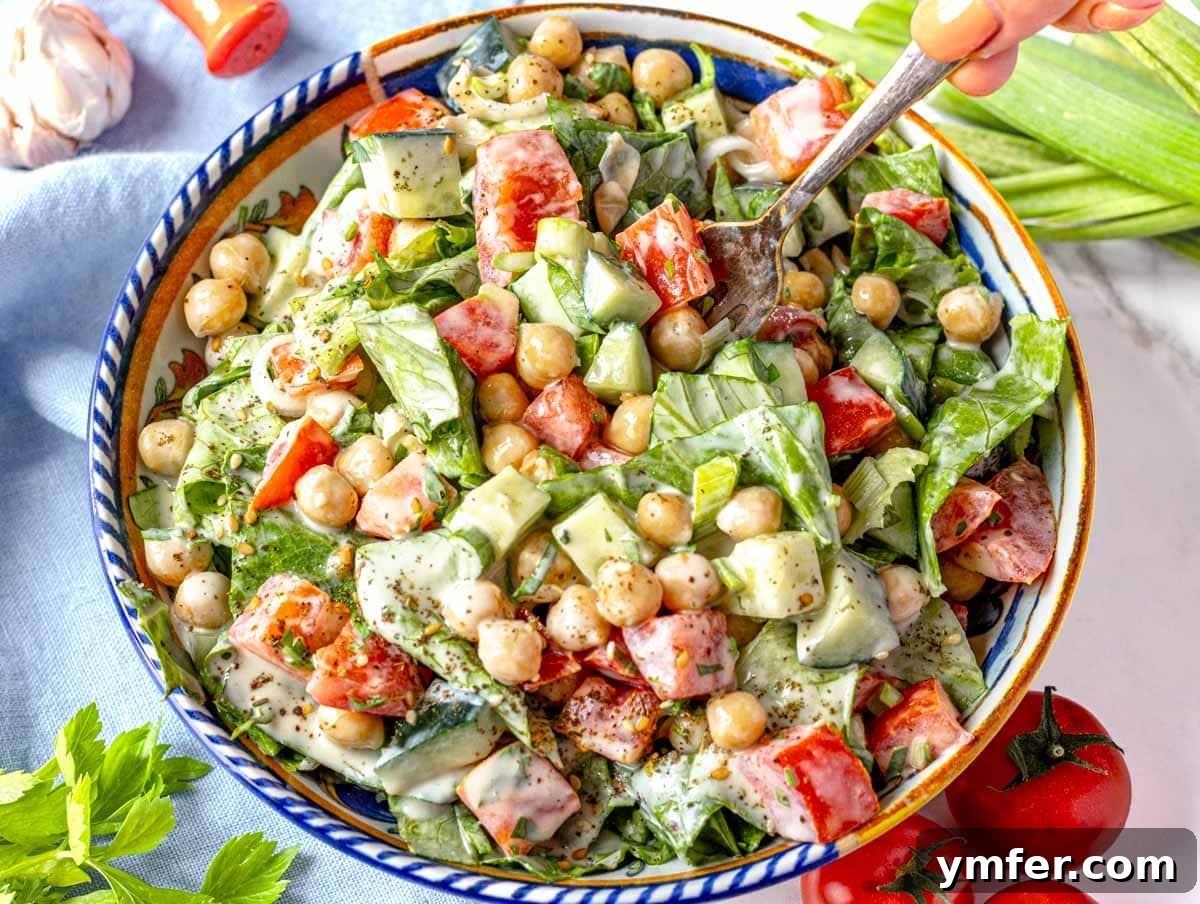 Zesty Tahini Salad 6 Tahini salad with hand holding a fork