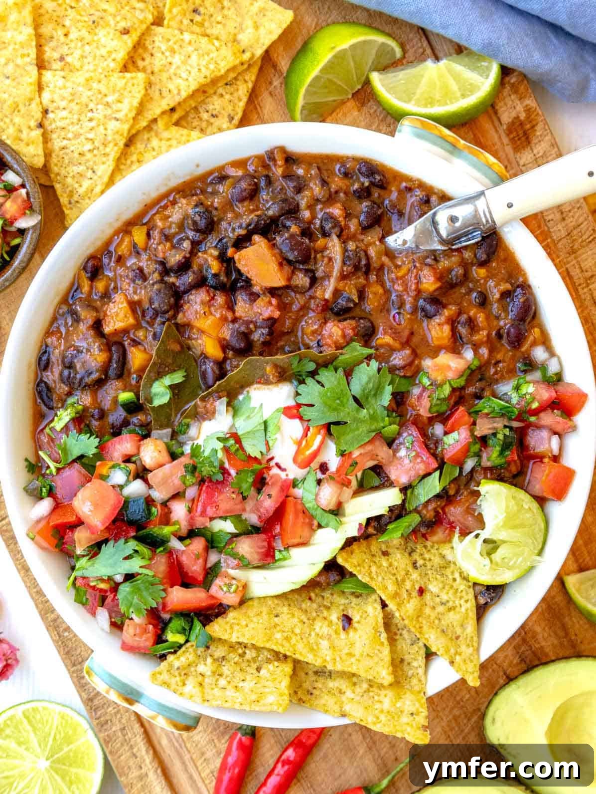 Rich Black Bean Comfort 2 Black bean soup topped with pico de gallo and sliced avocado