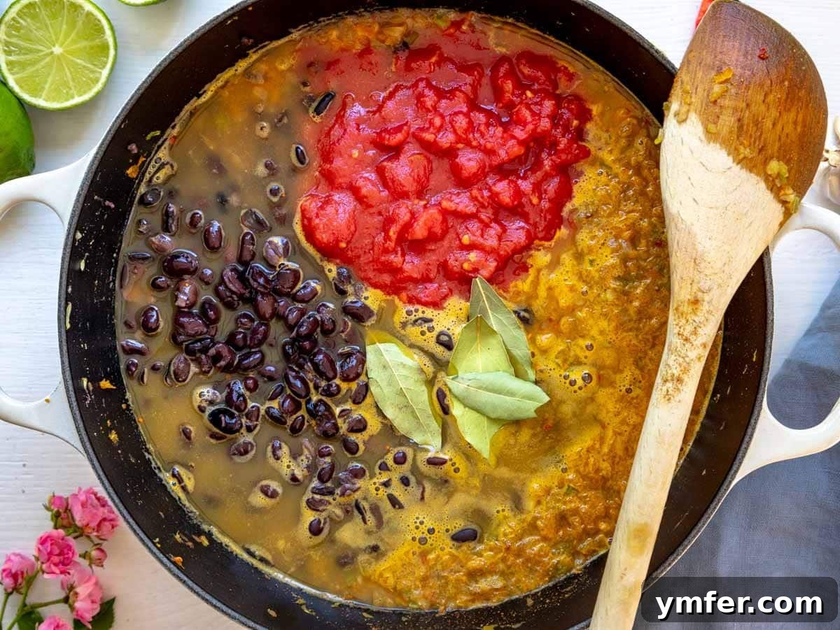 Rich Black Bean Comfort 5 Step 2: Soup simmering in a pot.