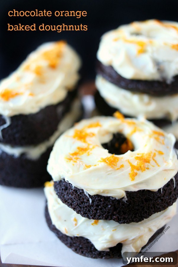 Decadent Chocolate Orange Baked Doughnuts with creamy orange frosting