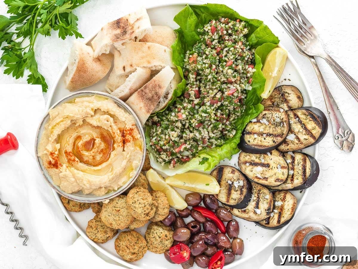 Creamy Tahini Yogurt Sauce 12 Mezze platter with tabbouleh, hummus, pita bread, and falafel