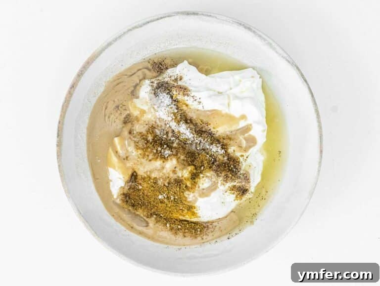 Yogurt Tahini Dressing ingredients in a bowl