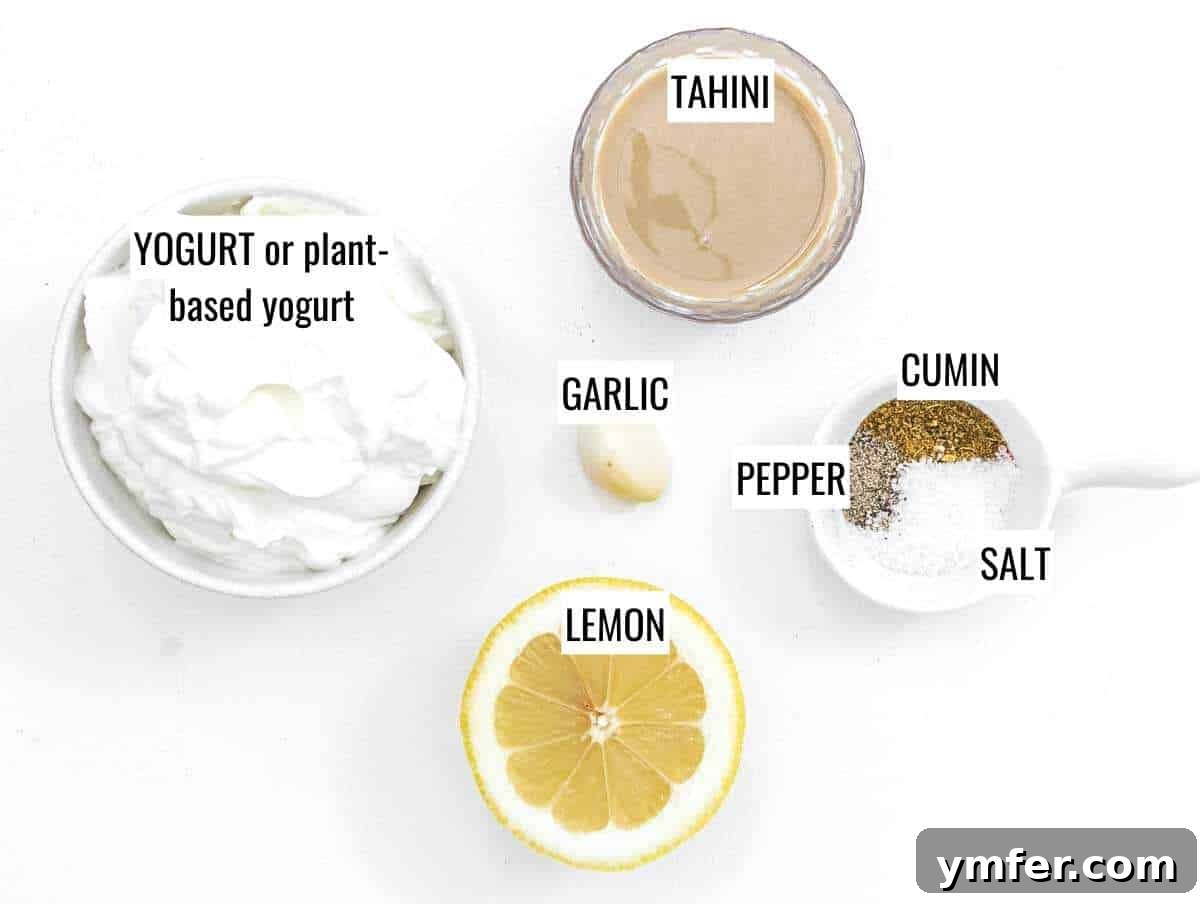 Creamy Tahini Yogurt Sauce 4 All the ingredients needed to make tahini yogurt sauce laid out on a table