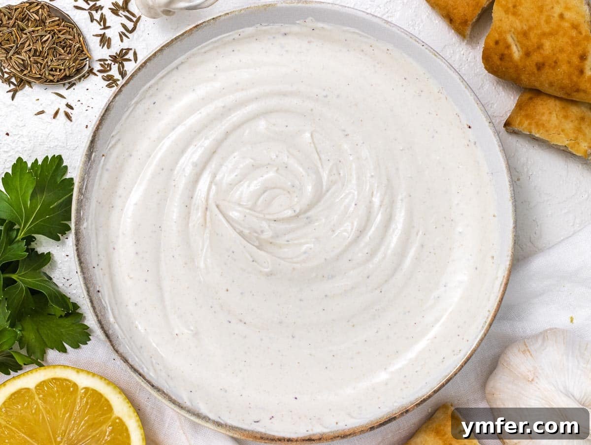 Creamy Tahini Yogurt Sauce 7 Finished yogurt tahini sauce in a bowl, perfectly mixed
