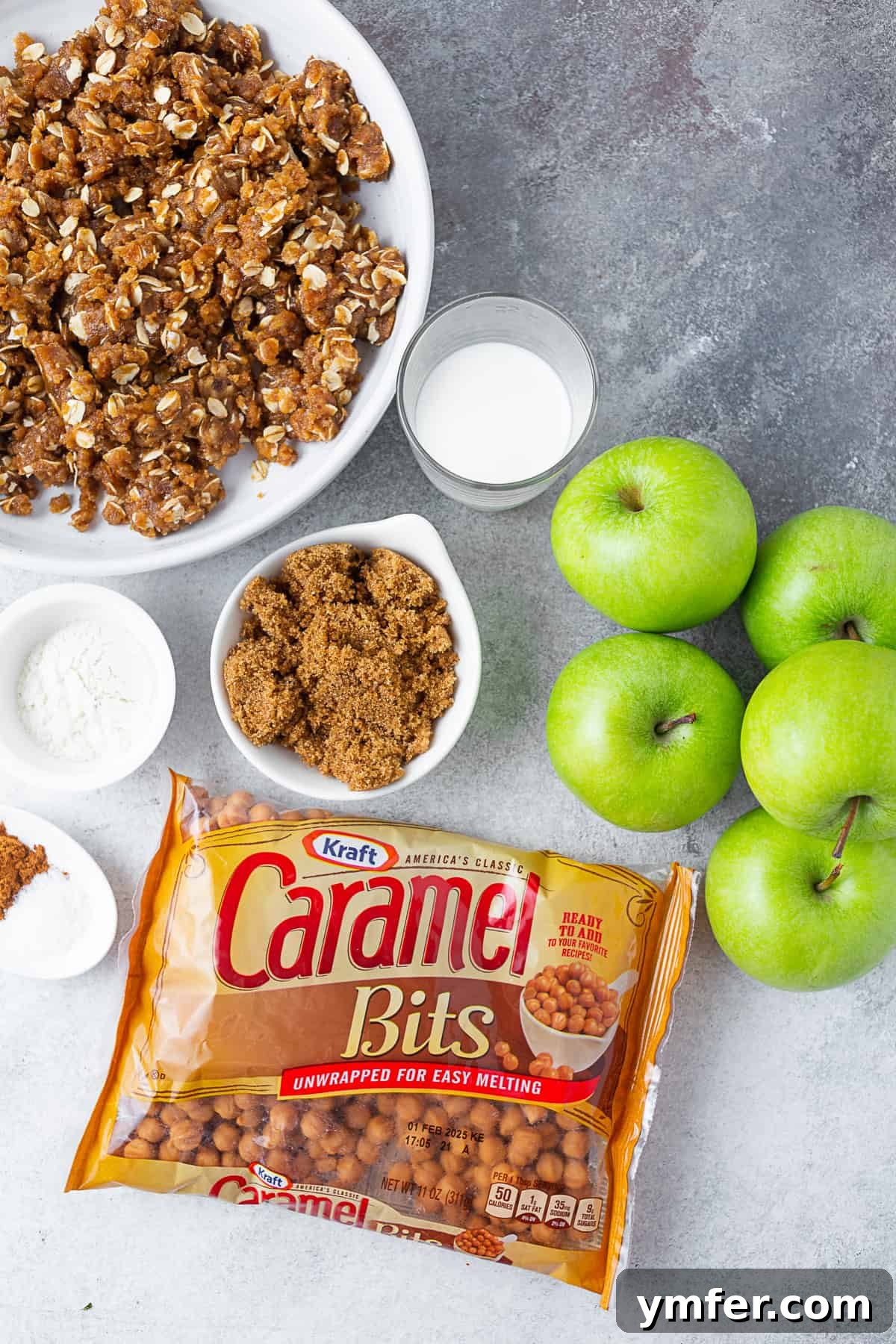 Sticky Caramel Apple Delight 3 A table with crumb topping ingredients: brown sugar, flour, spices, and caramel bits sitting on it.