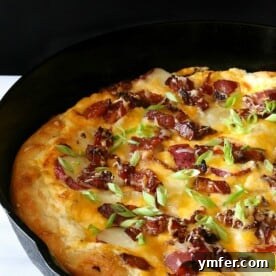 The Loaded Spud Pizza 5 Loaded baked potato pizza in a cast iron skillet